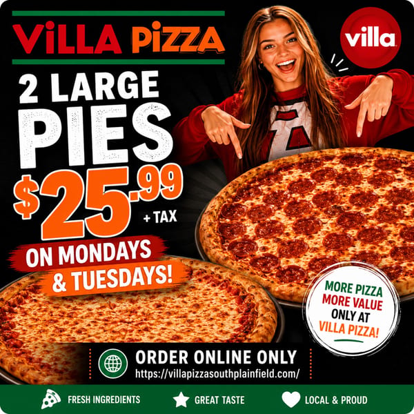 A smiling woman points to two large Villa Pizza pies, one pepperoni and one cheese.